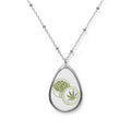Oval Cannabis Token Necklace — Silver Teardrop Pendant with Leaf Coin Design